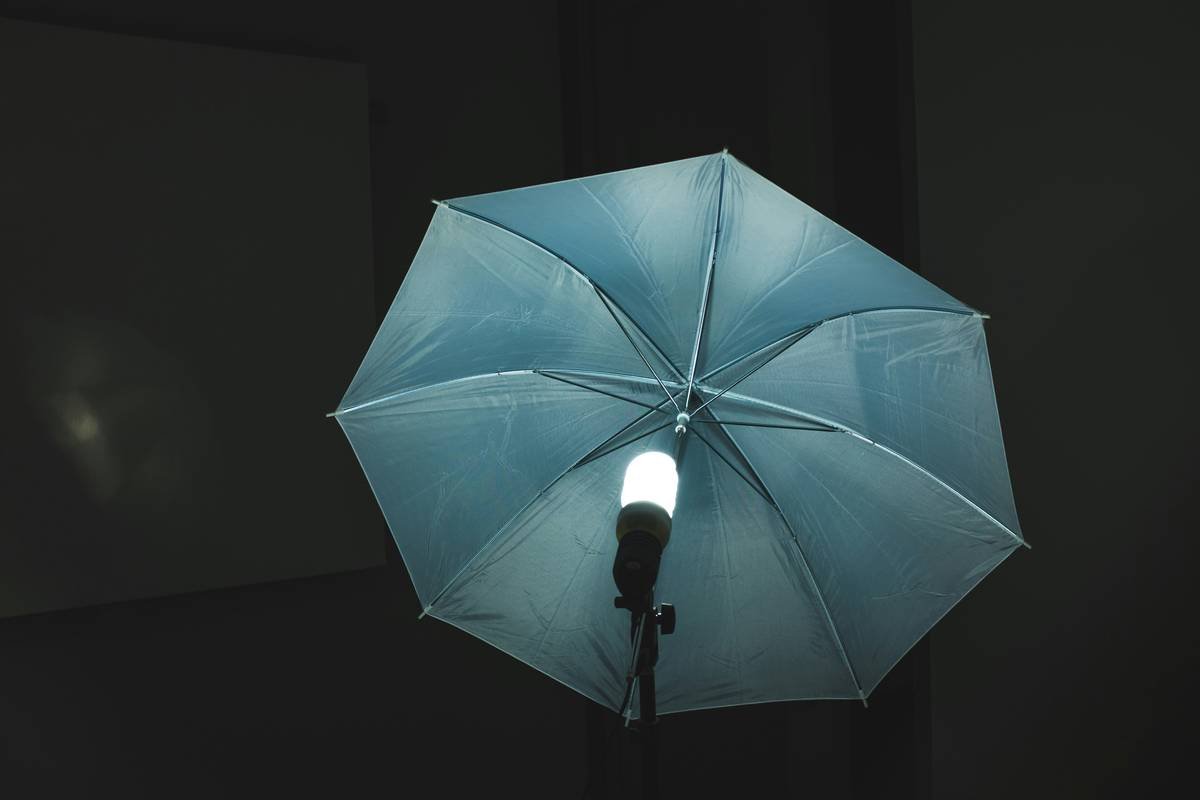 Close-up of uv resistant patio umbrella fabric showing tight weave and fade-resistant color after years of sun exposure