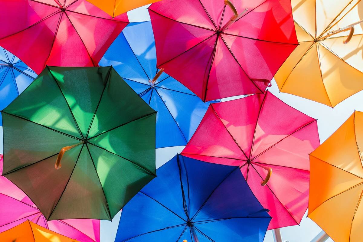 weather protection cantilever umbrella what color - showing faded dark canopy vs vibrant light canopy after 3 years of use